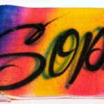 A close up of the word soph written in spray paint.