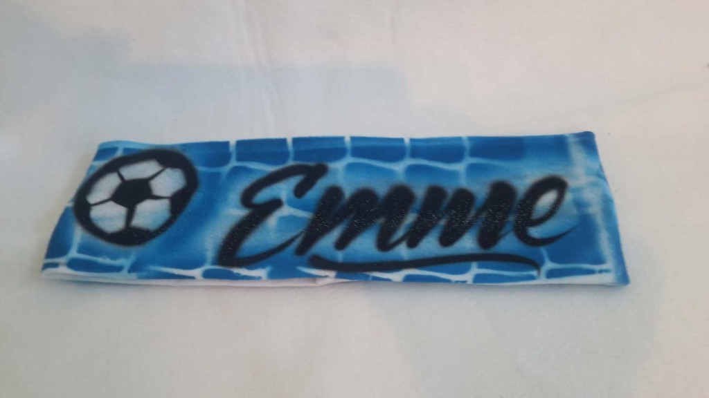 A blue and white name tag with black writing