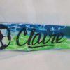 A close up of the name claire on a wristband