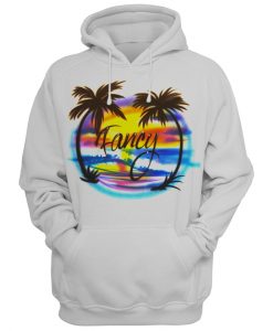 A white hoodie with a palm trees design on it